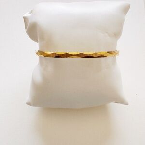 A gold-tone monet cuff bracelet, 6.5 inches.